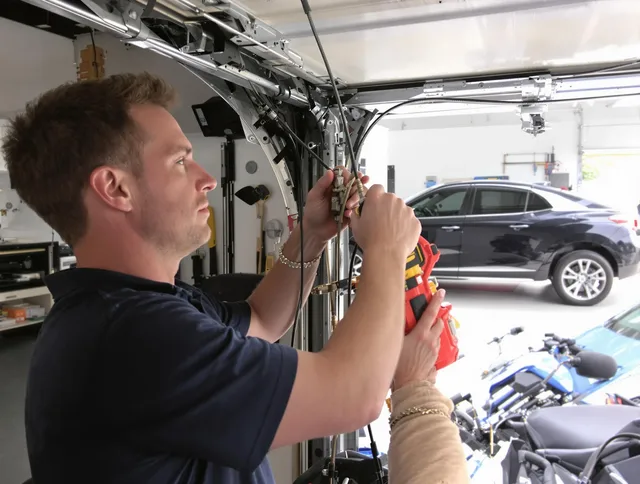 Menifee Garage Door Repair safety certified technician performing cable replacement in Menifee