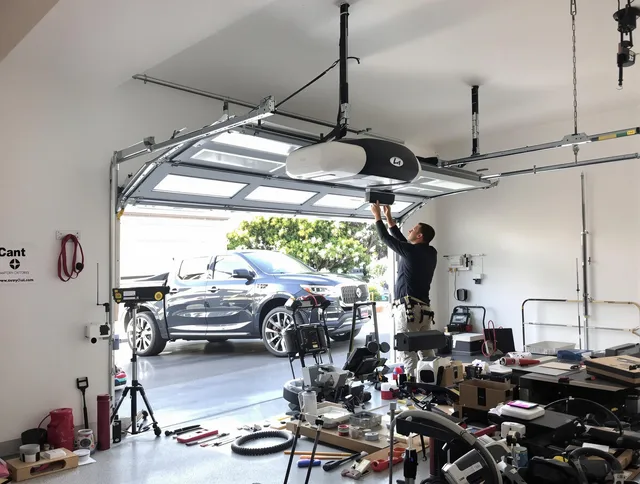 Menifee Garage Door Repair specialist installing smart garage door opener system in Menifee home