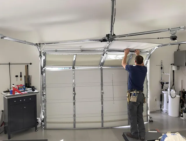 Menifee Garage Door Repair specialist performing precise section replacement on Menifee garage door